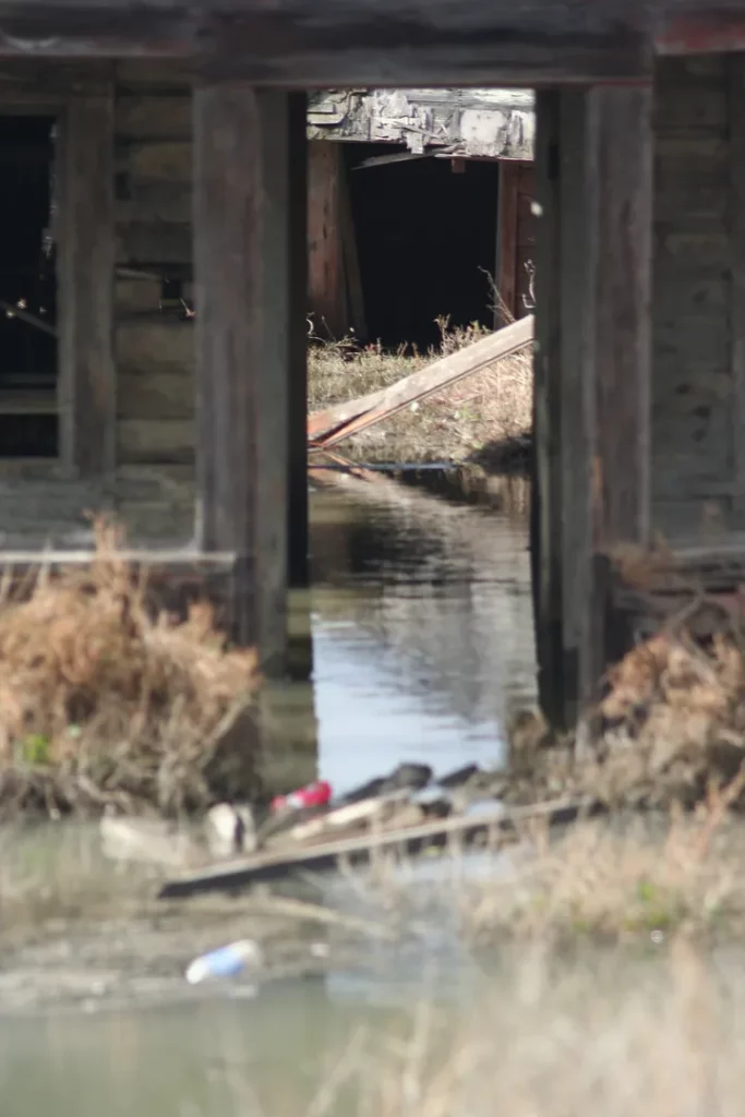 Water floods numerous broken down shacks in Drawbridge, CA.