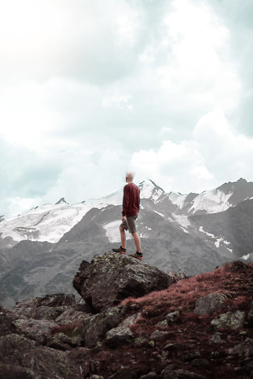 man standing on cliff
