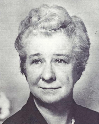 A photo of a middle-aged, well-dressed, lady.