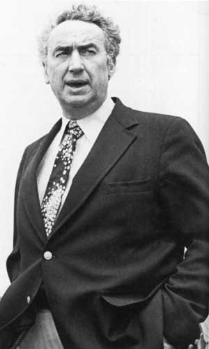 A photo of a middle-aged, well-dressed man.