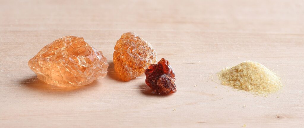 Gum arabic shown in crystaline and powdered forms.