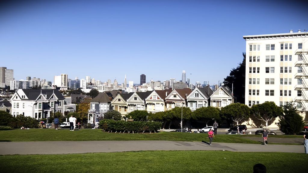 A row of Victorian Homes in front of downtown San Francisco.